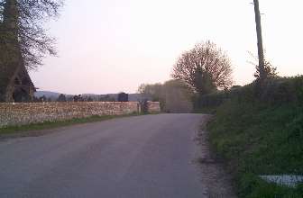 Road towards the A36. Church on Left.
